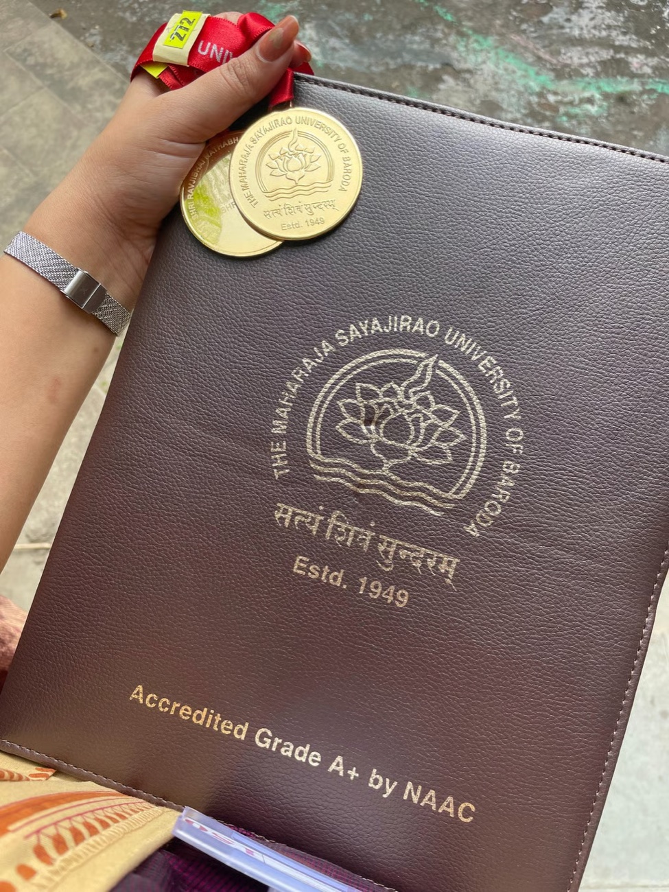 Shourya's two gold medals and folio from The Maharaja Sayajirao University of Baroda